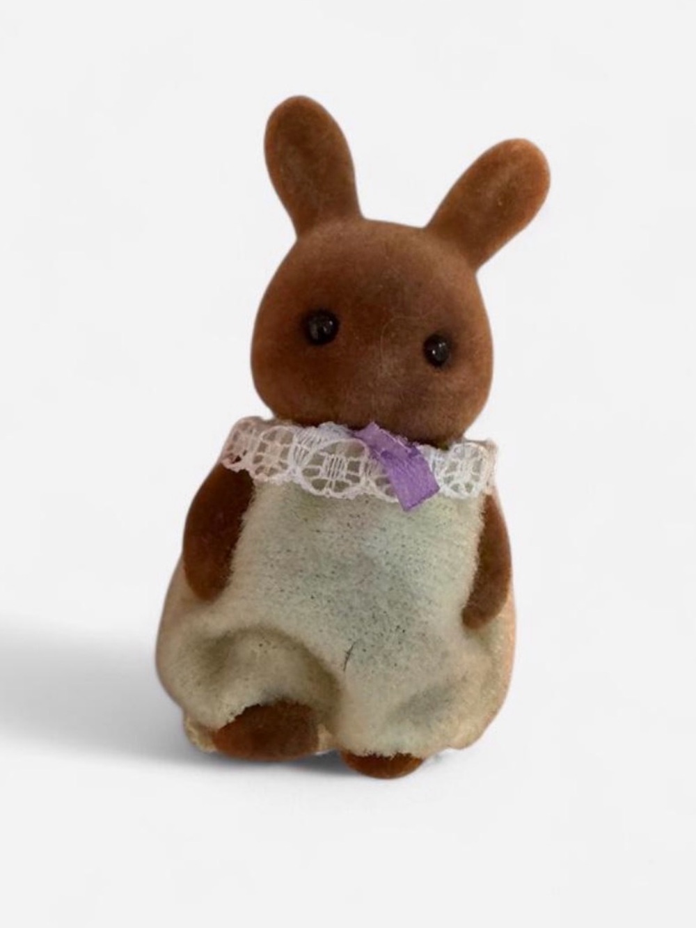 Brown Plush Bunny Figure with Cream Dress and Purple Bow Accent